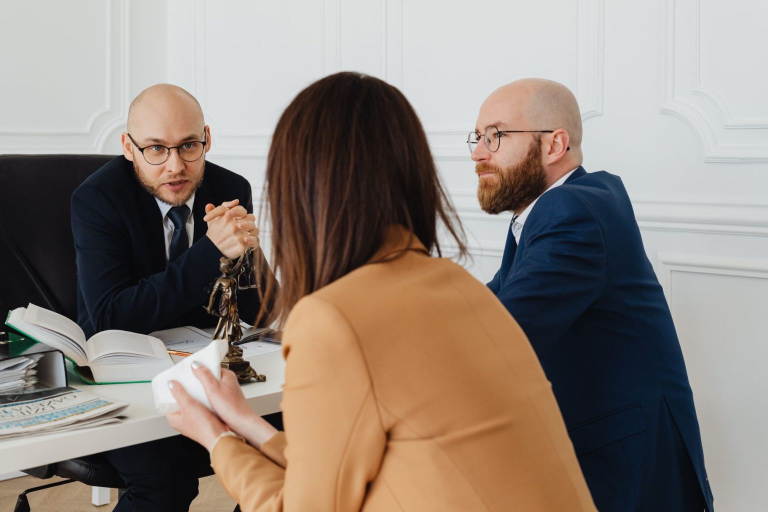 The Top 10 Personal Injury Law Firms in California of 2026 A lawyer consulting clients in a modern office