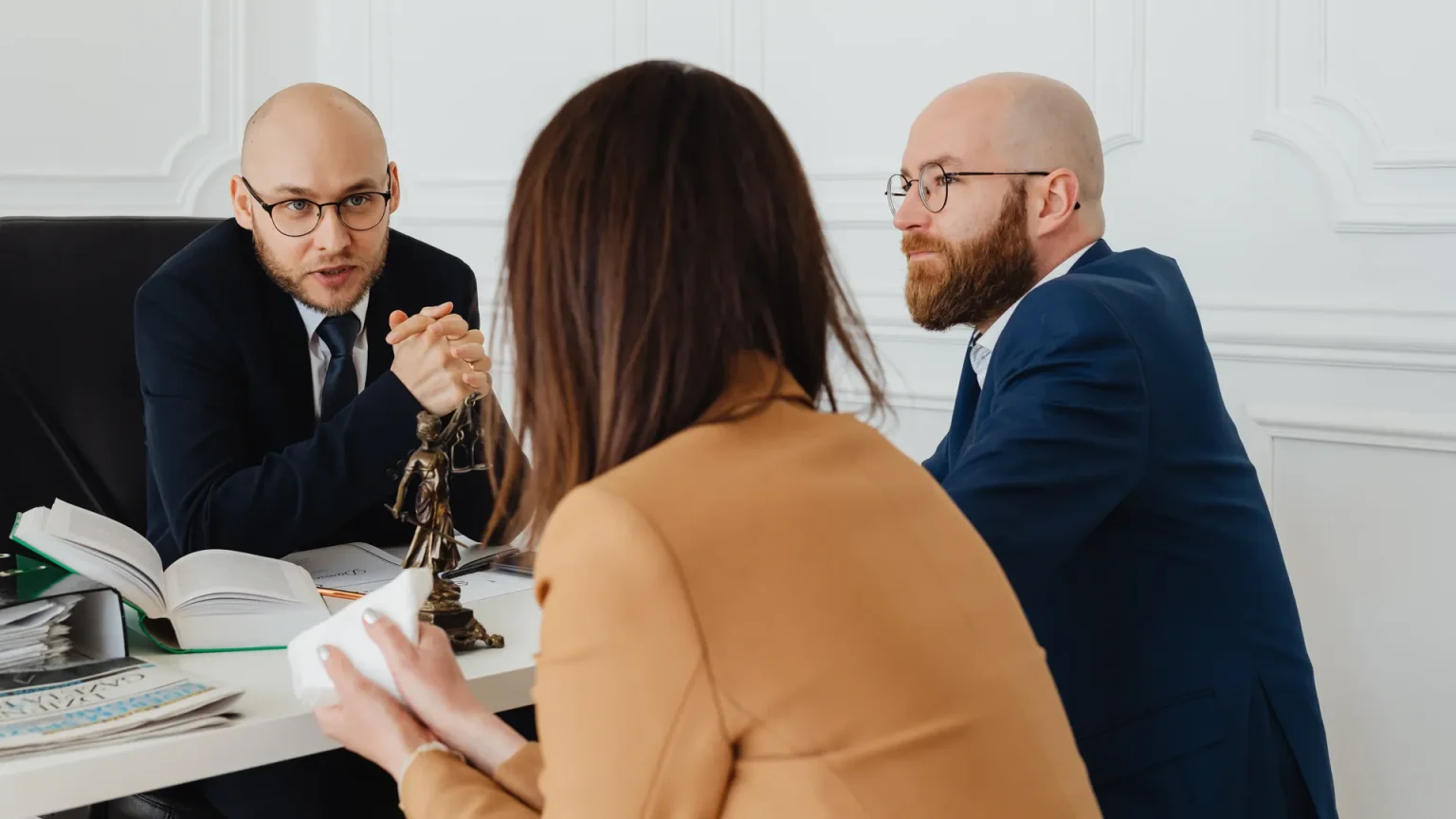 pexels-photo-7876197 Growing business owner consulting with corporate lawyer about legal requirements