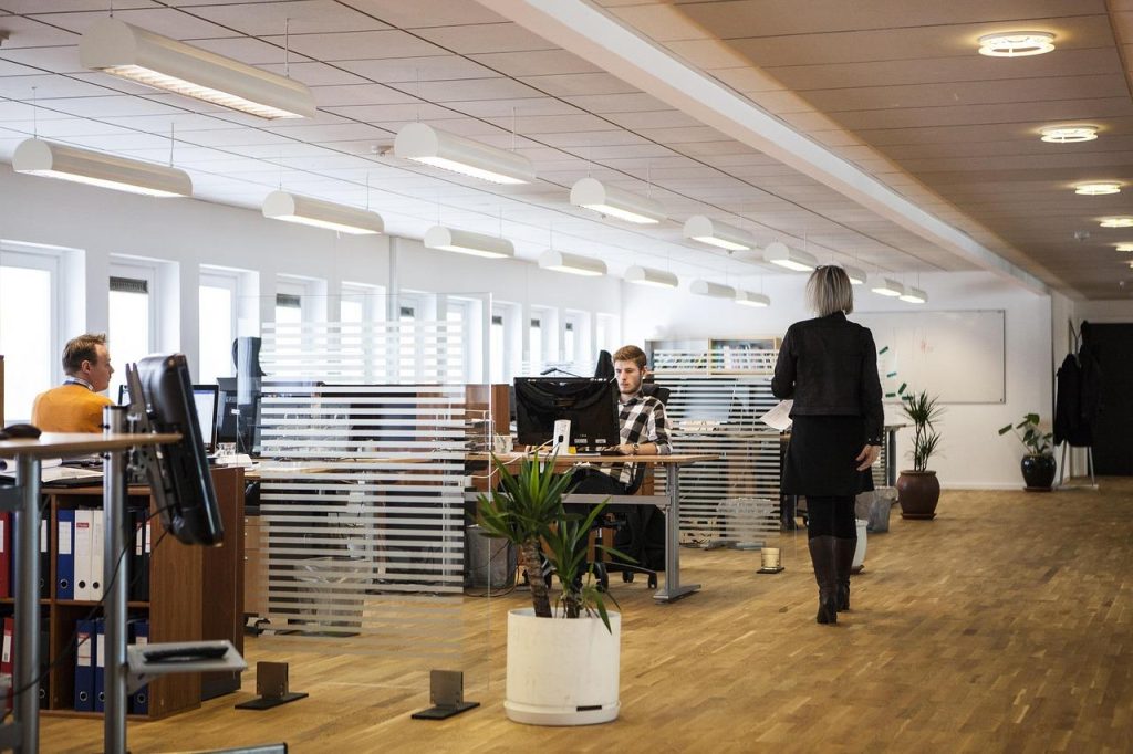 5-intellectual-property-risks-growing-businesses-should-address Open-plan office with staff working at desks