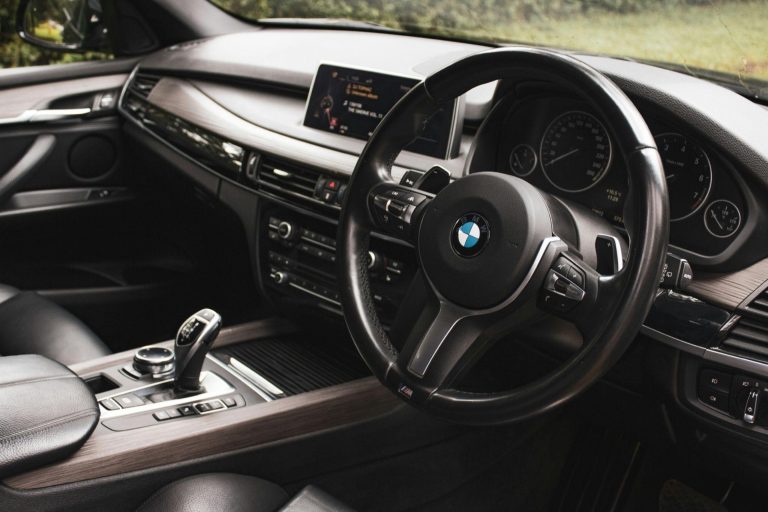 BMW interior with sports steering wheel, gear selector and centre console