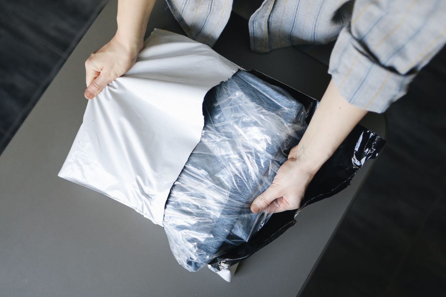 consumer-rights-and-product-customisation-what-online-retailers-need-t Person opening a parcel delivered after an online purchase