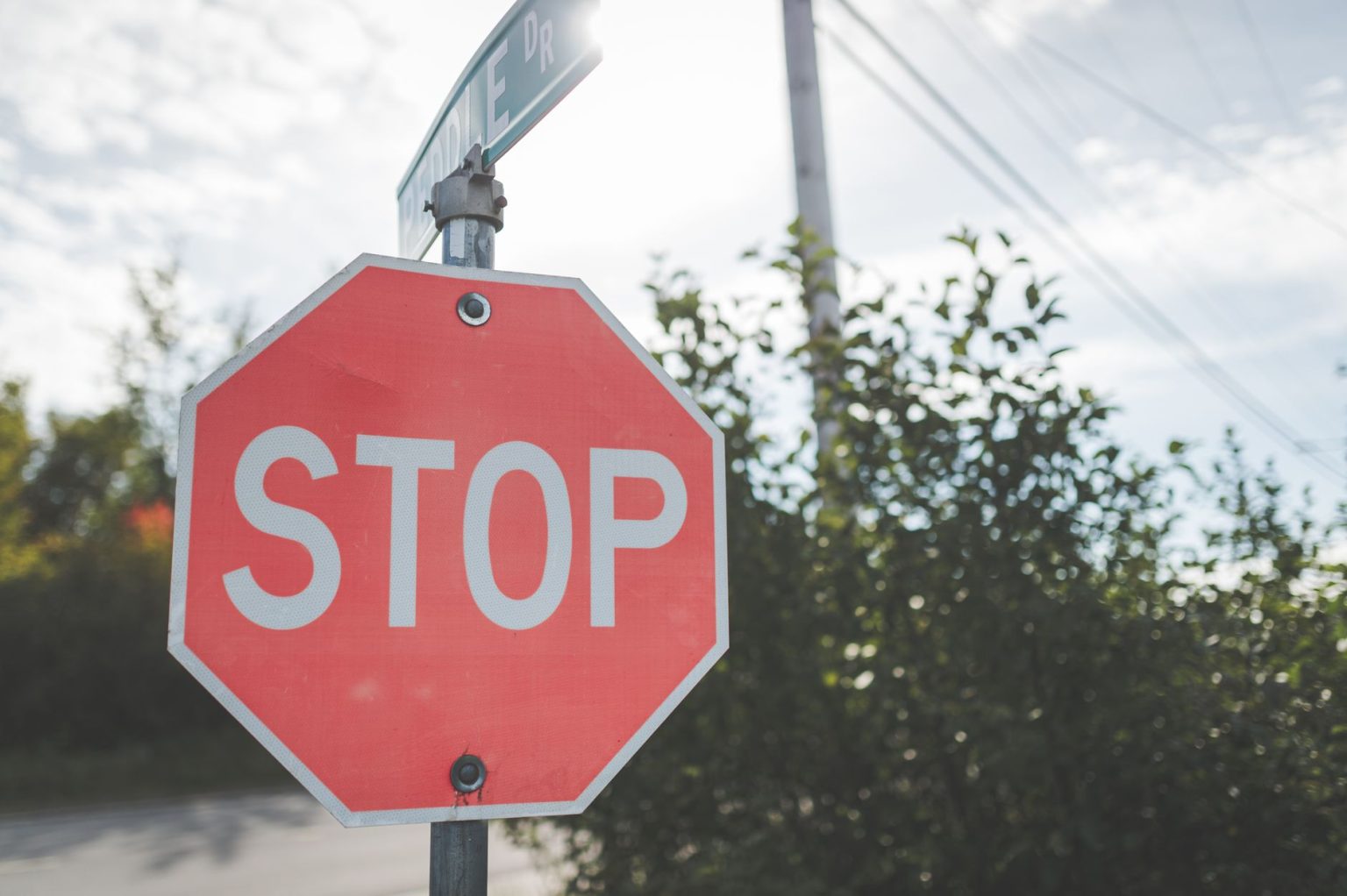 navigating-ontario-traffic-laws-rights-penalties-and-professional-lega Red stop sign on a pole at a road junction