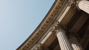Classical stone columns against a clear sky