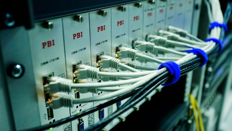 Network cables connected to a switch panel in a data centre