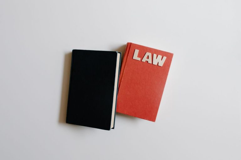 Law book and notebook on a desk