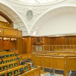 Historic courtroom with ornate wooden furnishings