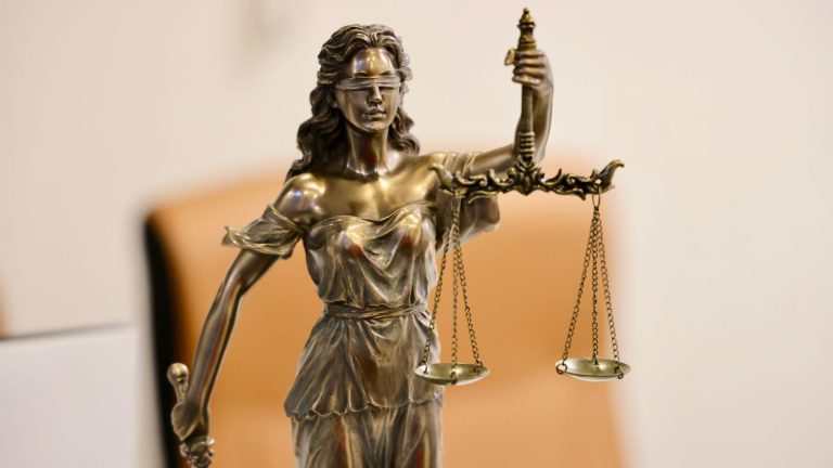 Statue of Lady Justice holding scales